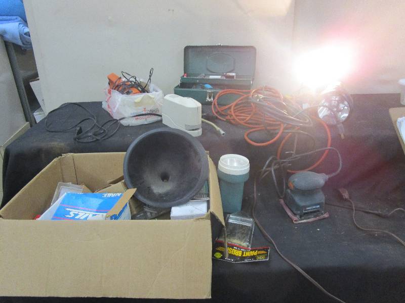 lot 43 image: Various Tools. Shop light, flashlight, electric stapler, greese gun, electrical chords and more