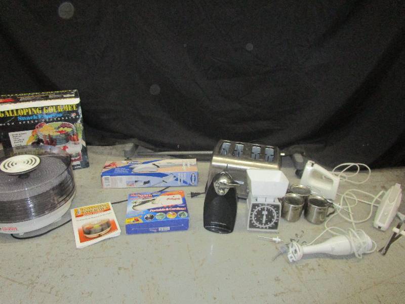 lot 44 image: New in box dehydrator, massager, sewing machine, electric knives, toaster, can openers, scales and mixer