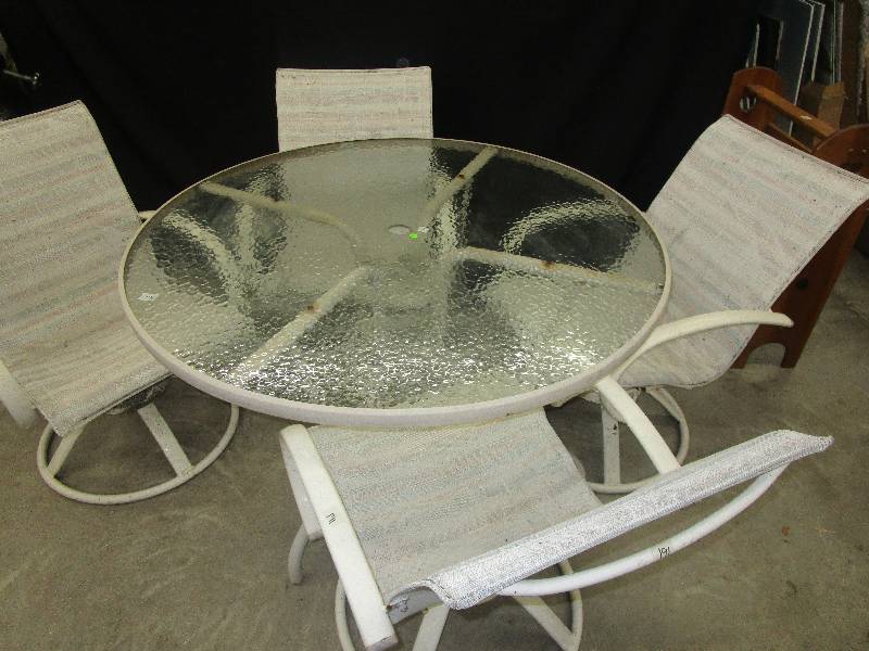 lot 70 image: Patio table and 4 Rocking Chairs