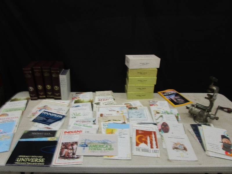 lot 73 image: National Geographic Cases empty and pile of varoius maps from all over the world and grinder