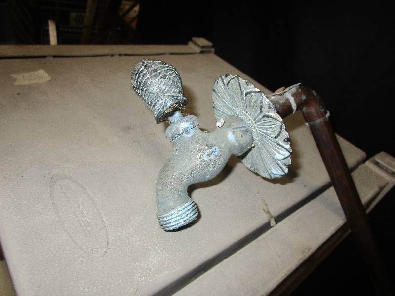 lot 74 image: Hose and hose reel, sander and faancy water spicket
