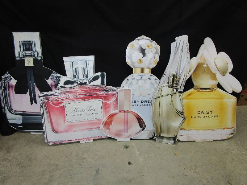 lot 83 image: 6-Thick styrofoam cut out bottles of perfume mostly 3 12 to 4 ft high