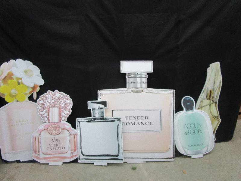 lot 84 image: 6-Thick styrofoam cut out bottles of perfume mostly 3 12 to 4 ft high