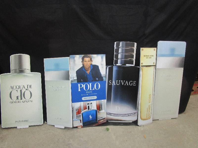 lot 85 image: 6-Thick styrofoam cut out bottles of perfume mostly 3 12 to 4 ft high