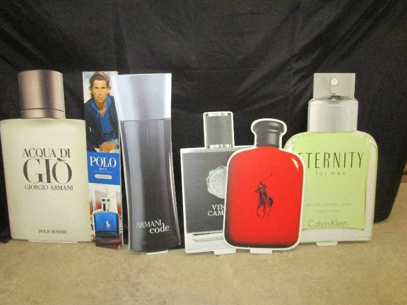 lot 82 image: 6-Thick styrofoam cut out bottles of perfume mostly 3 12 to 4 ft high