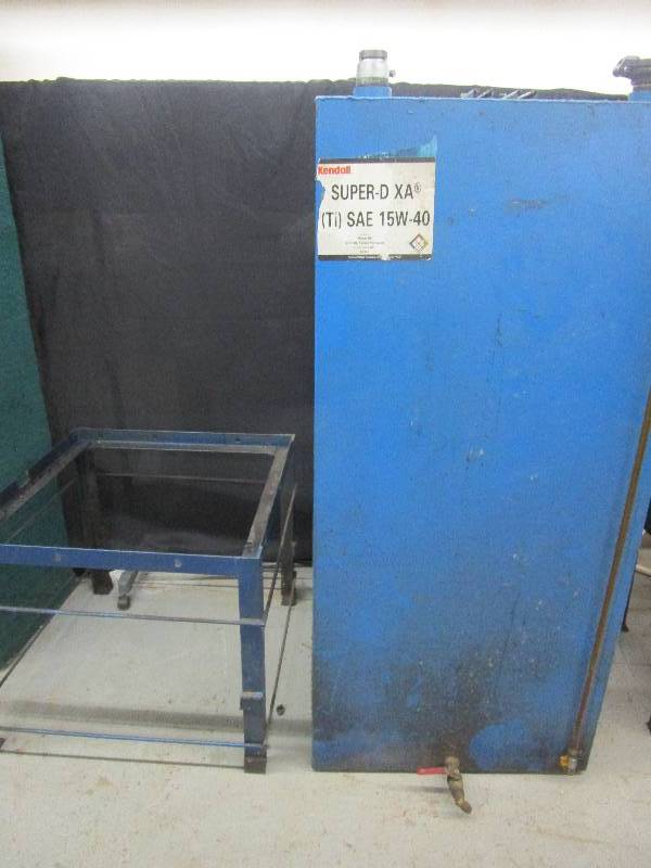 lot 90 image: Bulk Blue Oil Tank With Stand Stand is 24 Tall and Tank is 28L x 28 W x 61 12 H Come out of closing but operating shop