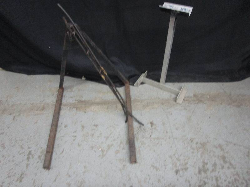 lot 101 image: Metal snowmobile ski ware bars and 2 snowmobile stands