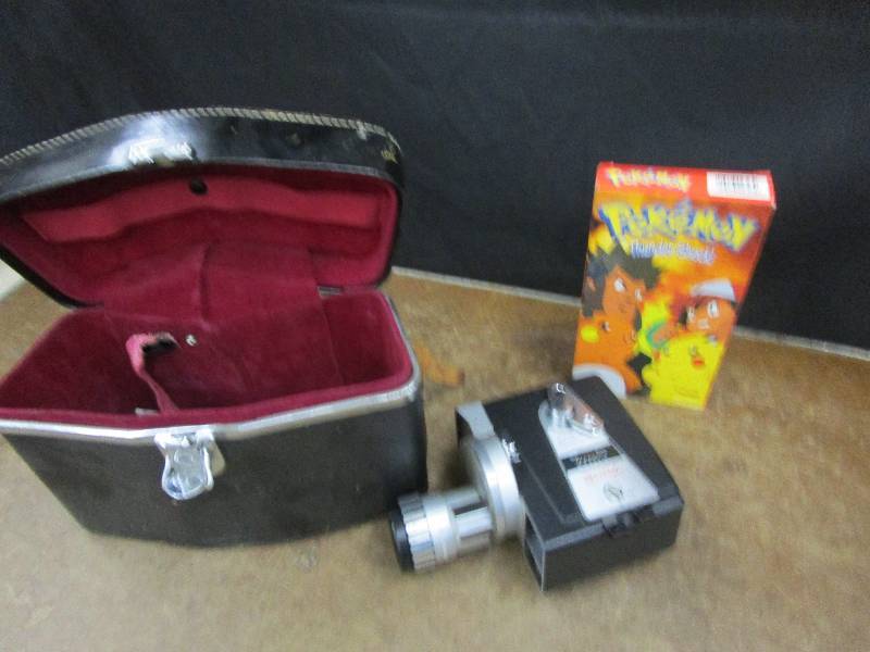 lot 128 image: Antique Adams Video Camera Camera and Pokemon VHS