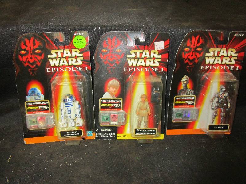 lot 144 image: Star Wars unopened in package Episode 1 R2-D2 with Booster Rockets new figures talk,  CommTech Chip, Annakin Skywalker with backpack and grease gun C-3po with chip so it talks