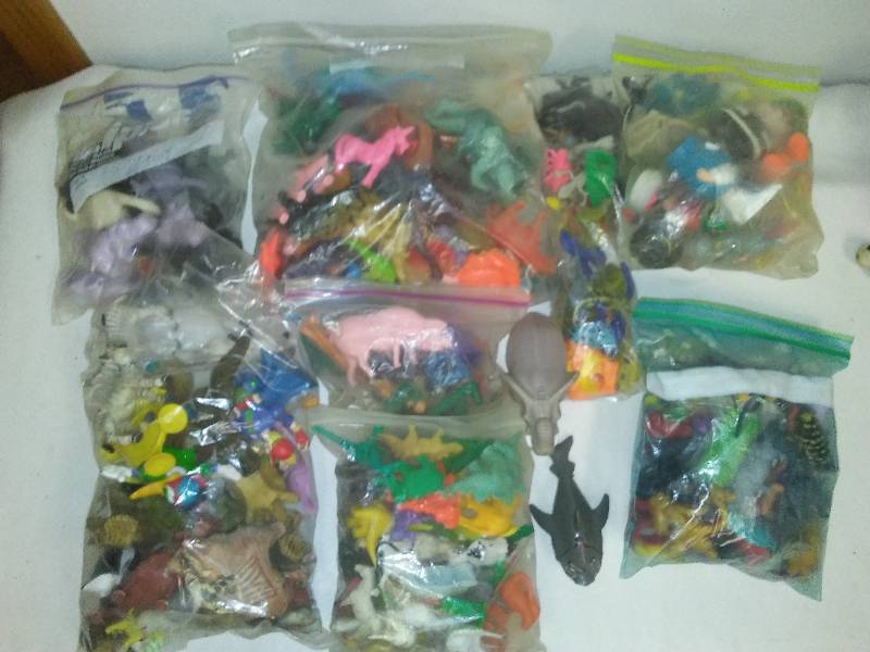 collection of plastic toys, too many to count
