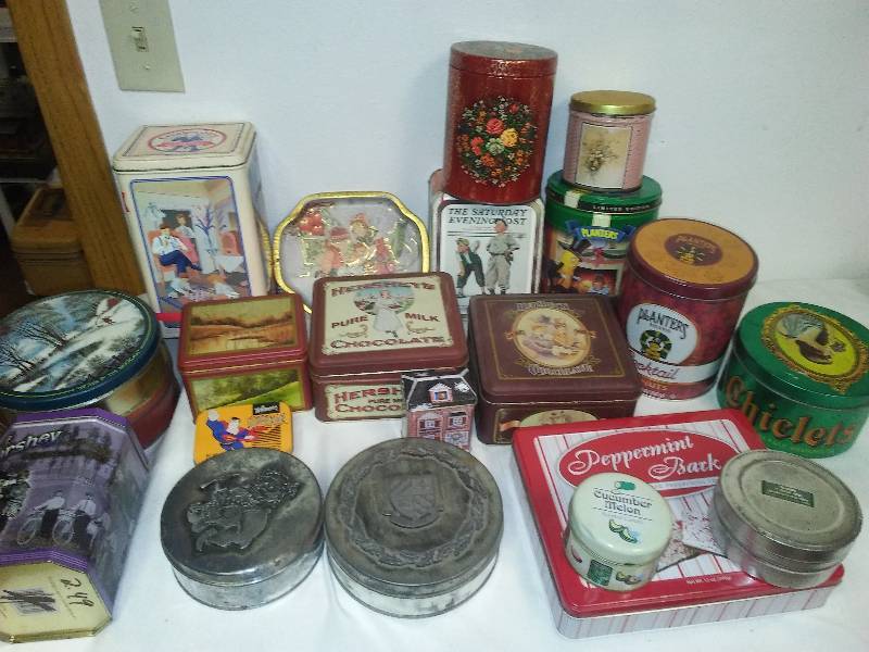 old and new tins