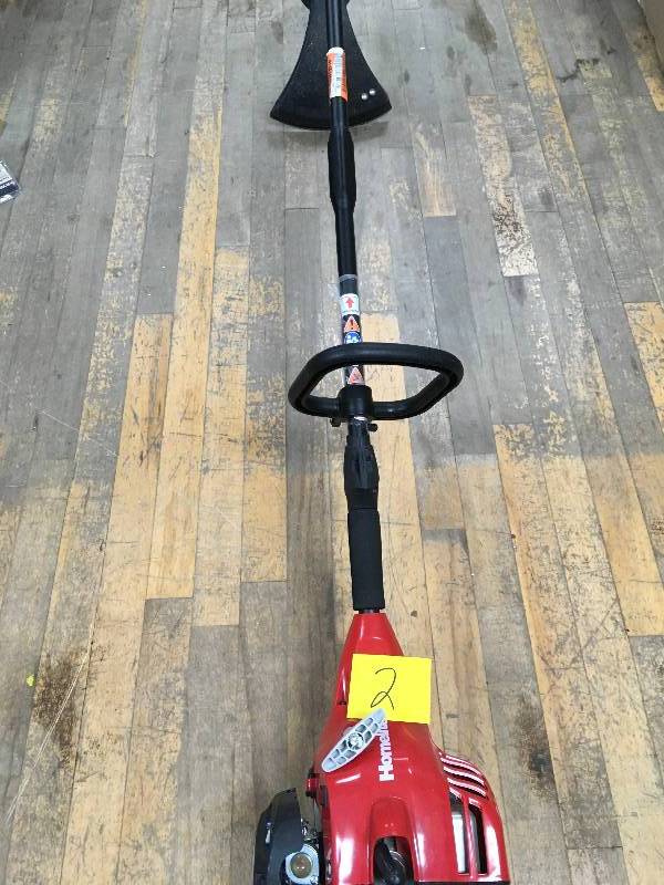 lot 2 image: Homelite 2-Cycle 26 cc Straight Shaft Gas Trimmer in working conditions