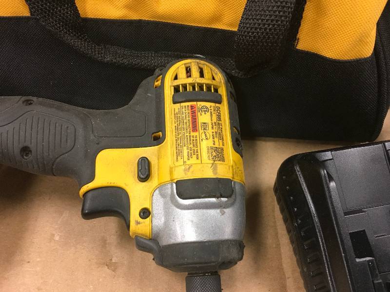 lot 60 image: Dewalt 20-Volt MAX Lithium-Ion Cordless 14 in. Impact Driver with Battery 1.3Ah, Charger and Contractor Bag used in working conditions