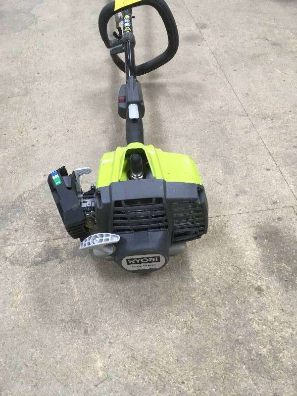 lot 68 image: Ryobi  2-Cycle Attachment Capable Full Crank Straight Gas Shaft String Trimmer used in working condition