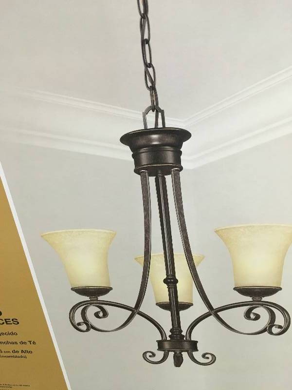 lot 89 image: Hampton Bay Essex 3-Light Aged Black Chandelier with Tea Stained Glass Shades New