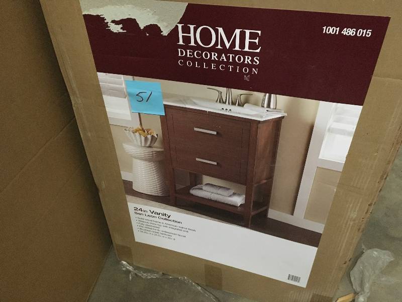 lot 51 image: Home decorators collection San Leon 24.5 in  Vanity in American Walnut with Vitreous China Vanity Top in White not used