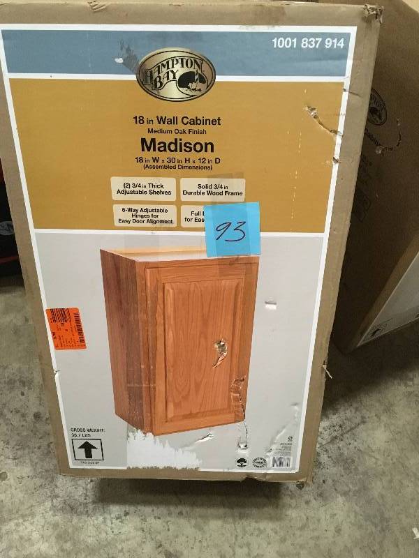 lot 93 image: HAMPTON BAY Madison Assembled 18x30x12 in. Wall Cabinet in Medium Oak in good conditions