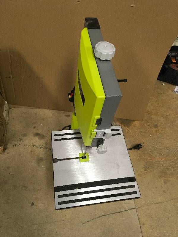 lot 104 image: RYOBI 2.5 Amp 9 in. Band Saw in working conditions