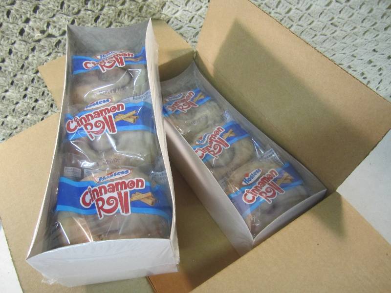 lot 205 image: Case of 6 Packs with 6 Hostess Cinn...