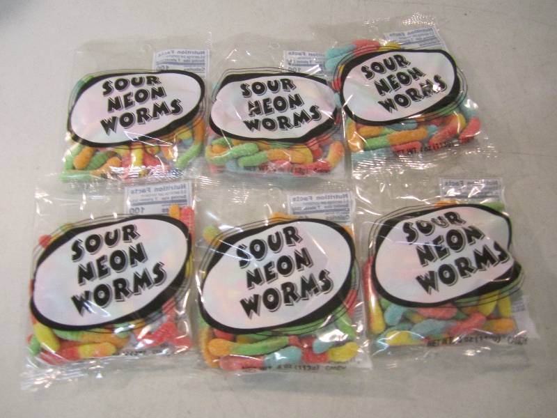 lot 209 image: 6 Bags of Sour Neon Worms Best by F...