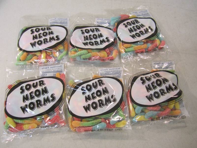 lot 210 image: 6 Bags of Sour Neon Worms Best by F...