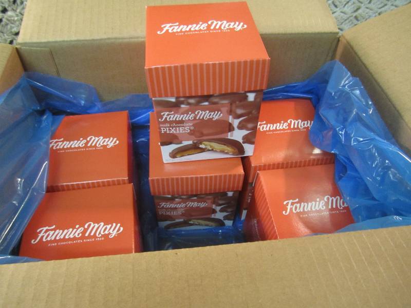 lot 254 image: Case of 6 Boxes of Fannie May Milk ...