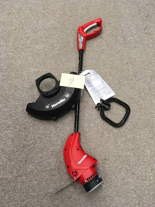 lot 9 image: Homelite 13 in. 4 Amp Straight Electric String Trimmer  in working conditions