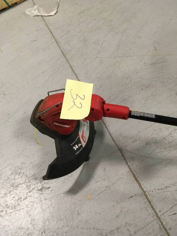 lot 32 image: HOMELITE 14 in. 5 Amp Straight Electric String Trimmer Used in good working condition