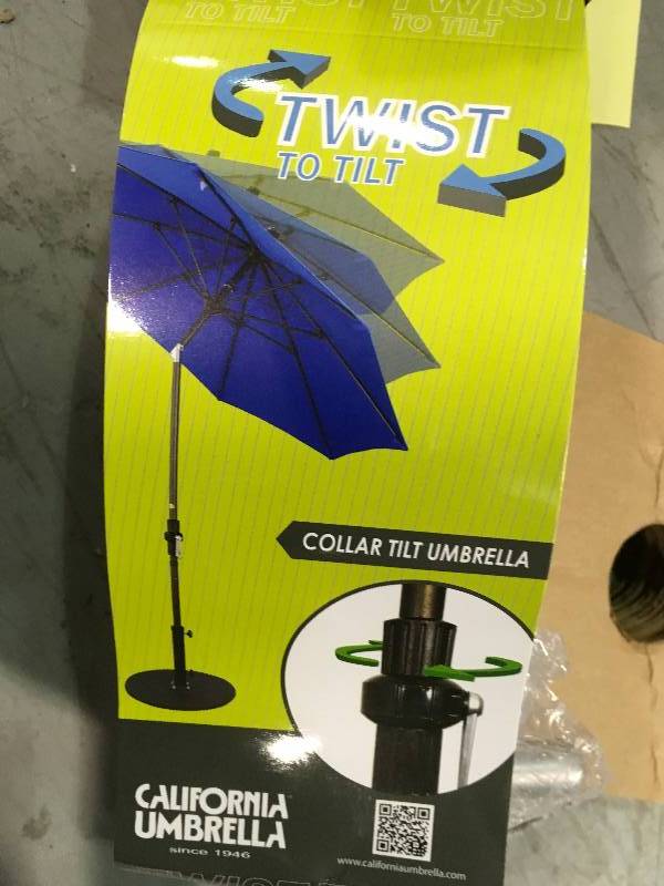lot 85 image: California Umbrella 9 ft. Fiberglass Collar Tilt Patio Umbrella in Black Pacifica not used