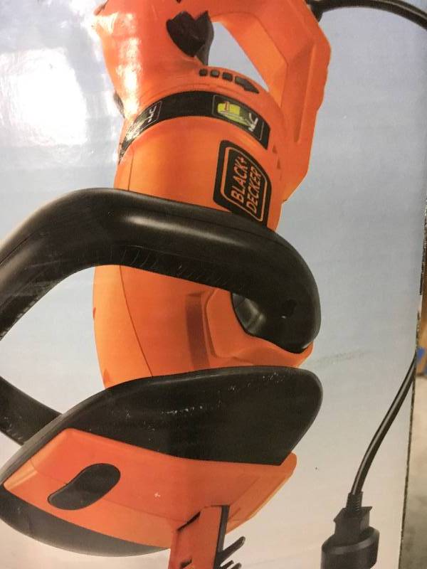 lot 108 image: Black & Decker 24 in. 3.3-Amp Corded Electric Hedge Hog Trimmer with Rotating Handle