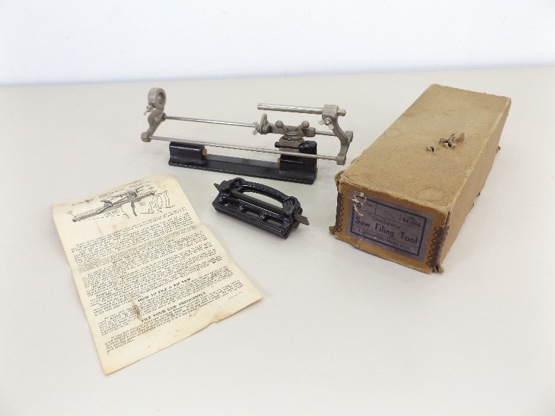 lot 7 image: Vintage Montgomery Ward & Co. Overhanging Saw Filing Tool with Instructions, and Original Box