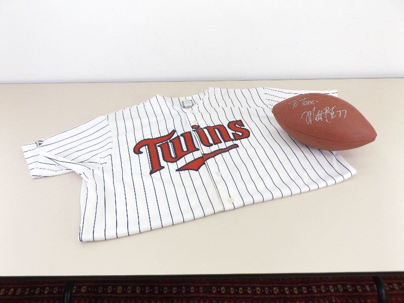 lot 47 image: Football Signed by MN Vikings Matt Blair, and MN Twins Joe Mauer Jersey
