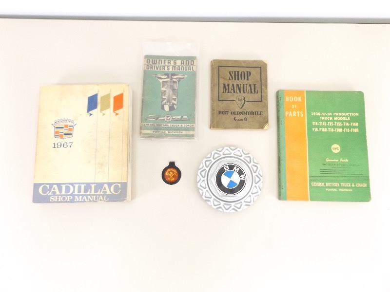 lot 48 image: Cadillac, GMC, etc. Manuals and Collectibles