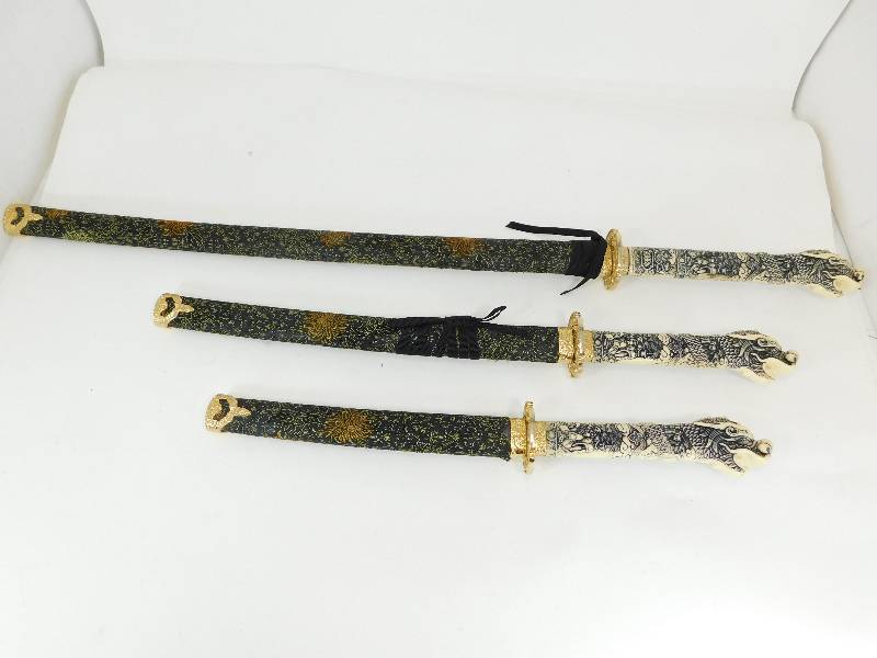 lot 29 image: Three Piece Set---- Different Size Swords In Sheaths