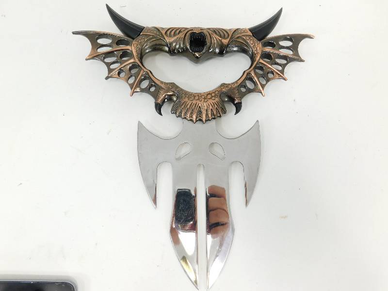 lot 50 image: Stainless Steel Hand Held Ornate Dagger From China