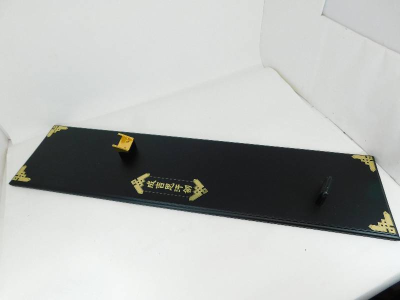 lot 69 image: Black Wooden Wall Display For A Sword