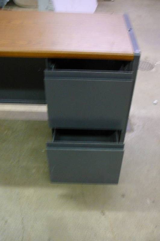 lot 22 image: Steel Desk 2 Drawer 65 w x 30 x 10 Top Woodgrain Look