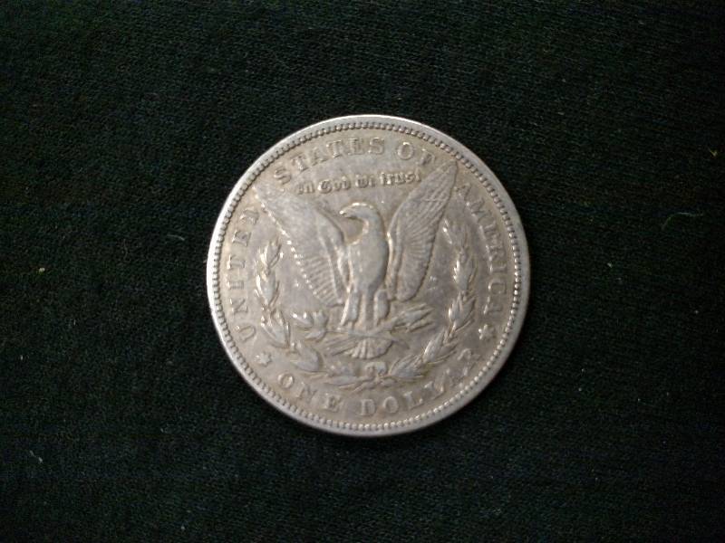 lot 12 image: 1884 Morgan Silver Dollar...