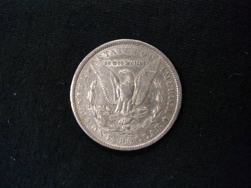 lot 13 image: 1885 O Morgan Silver Dollar...