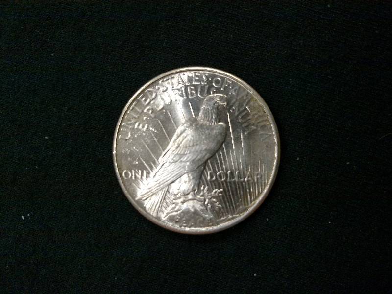 lot 24 image: 1925 Peace Silver Dollar...