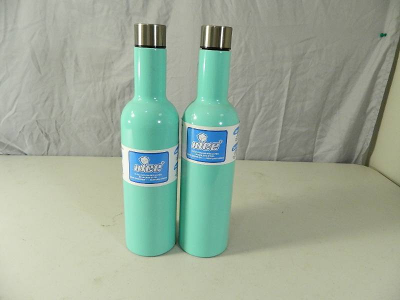lot 44 image: 2 New Seafoam Green nICE Wine Growlers