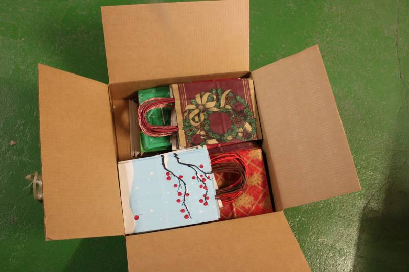 lot 114 image: 150 Medium Size Assorted Holiday Gift Bags with Handles