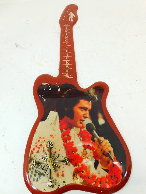 lot 59 image: King Lives Guitar Shaped  Battery Operated Clock
