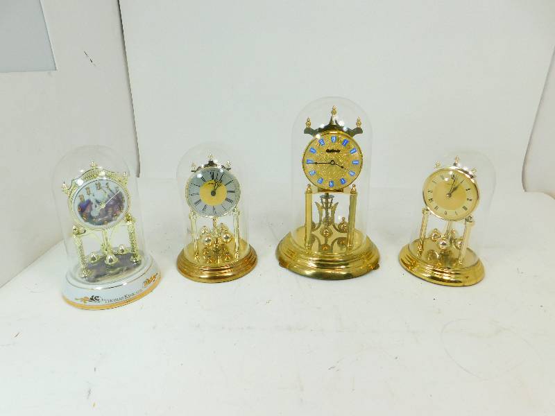 lot 60 image: Four Battery Operated Anniversary Clocks