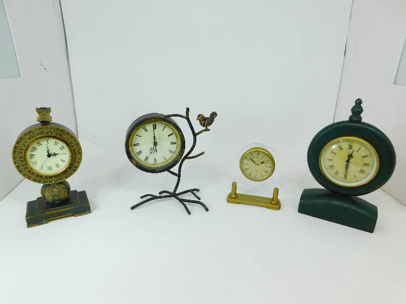 lot 73 image: Four Vintage Battery Operated Mantel Clocks