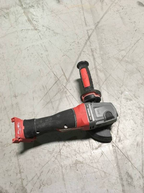 MILWAUKEE M18 FUEL 18-Volt Lithium-Ion Brushless Cordless 4-12 in. 5 in. Grinder W Paddle Switch (Tool-Only) USED working conditions