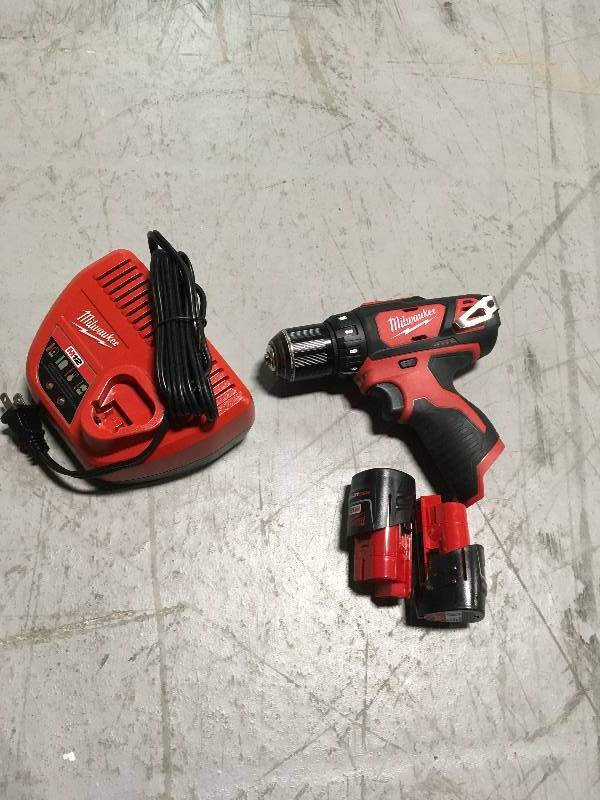 MILWAUKEE M12 12-Volt Lithium-Ion Cordless 38 in. DrillDriver Kit with (2) 1.5ah Batteries, Charger and Tool Bag in working conditions