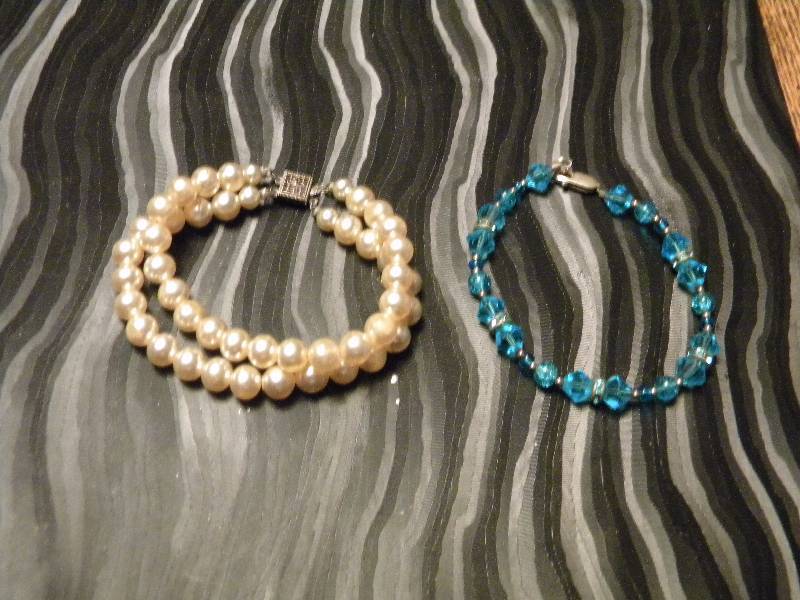 2 Bracelets each with a Sterling Silver Clasp