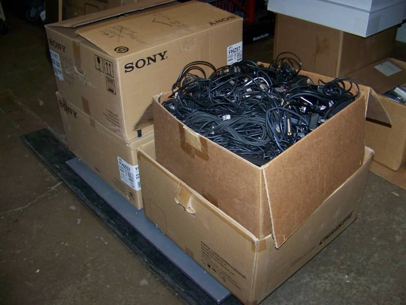 lot 102 image: (4 Large Boxes) Miscellaneous Audio  Video Cables, Connectors, Keyboards, Accessories, Remotes and more
