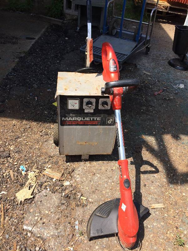 lot 97 image: Craftsman Electric Weed whipper and Marquette battery charger
